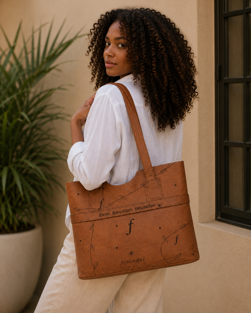 Woman carrying large brown Frounder tote bag