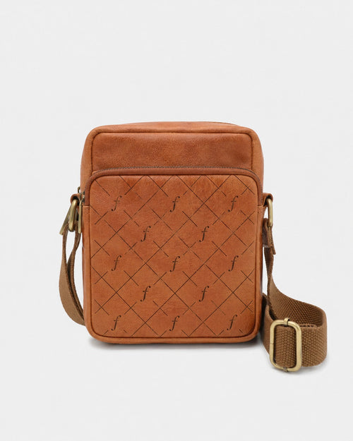 Brown leather crossbody bag with quilted pattern