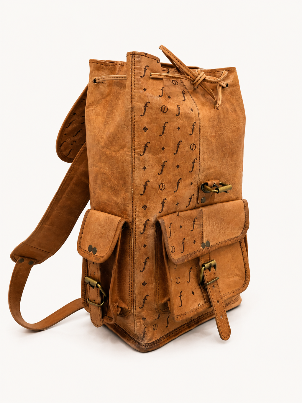 Brown leather backpack with decorative patterns