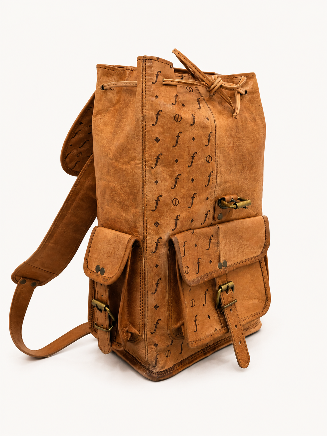 Brown leather backpack with decorative patterns