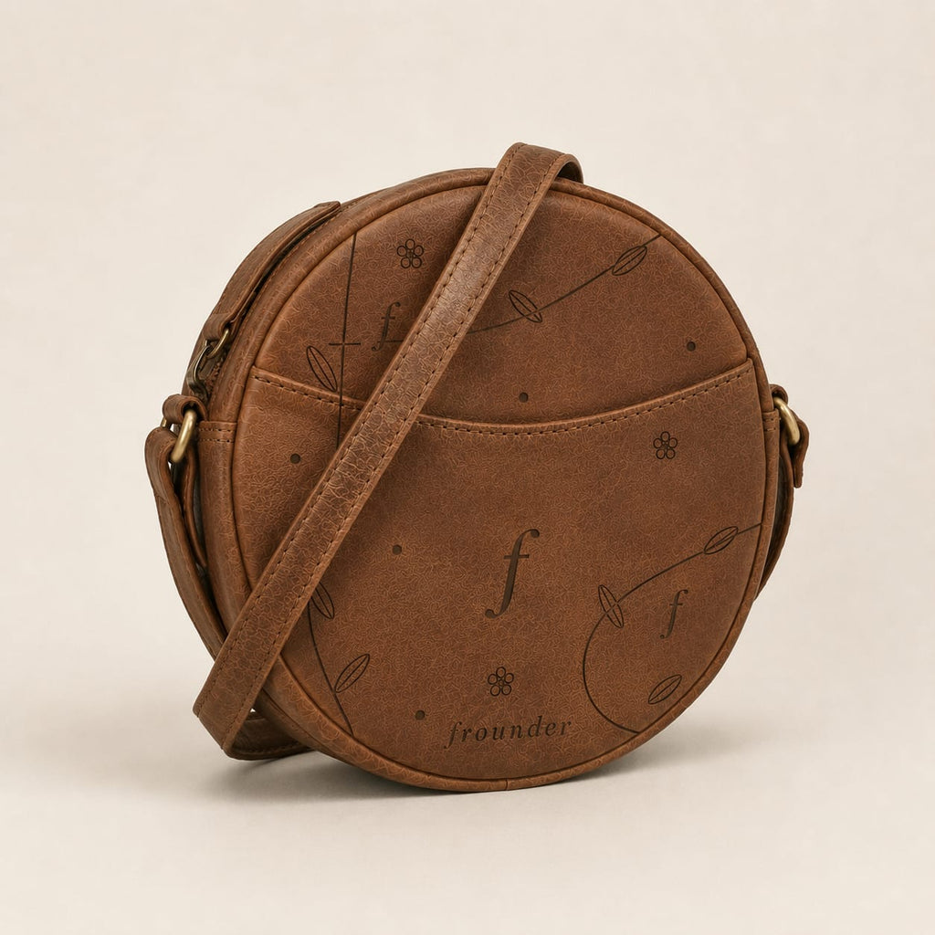 Brown round leather bag with pattern