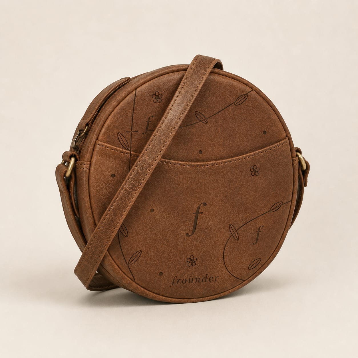 Brown round leather bag with pattern